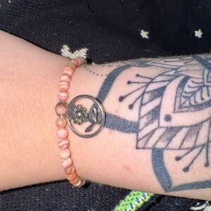 Chic Pink Beaded Bracelet with Silver Floral Accent